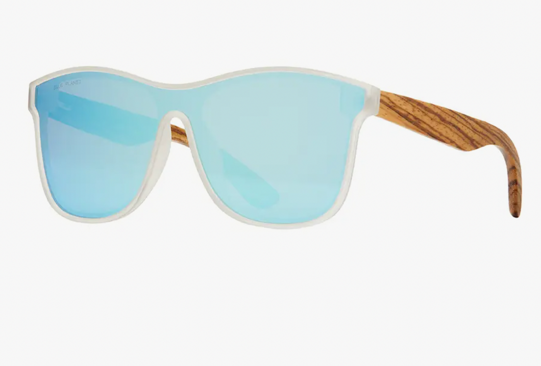 A pair of sporty sunglasses with a clear, frosted frame and smooth wooden temples. The single-piece lens features a reflective blue tint. The brand 'BLUE PLANET' is printed in the top left corner of the lens. The glasses have a casual yet stylish design, suitable for both outdoor activities and everyday wear, showcased against a plain, light background.