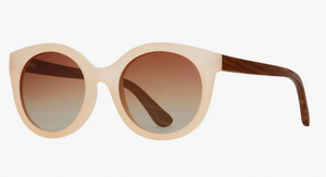 Oversized round sunglasses with a creamy beige frame and wooden temples, featuring brown gradient lenses for a blend of retro and natural style.