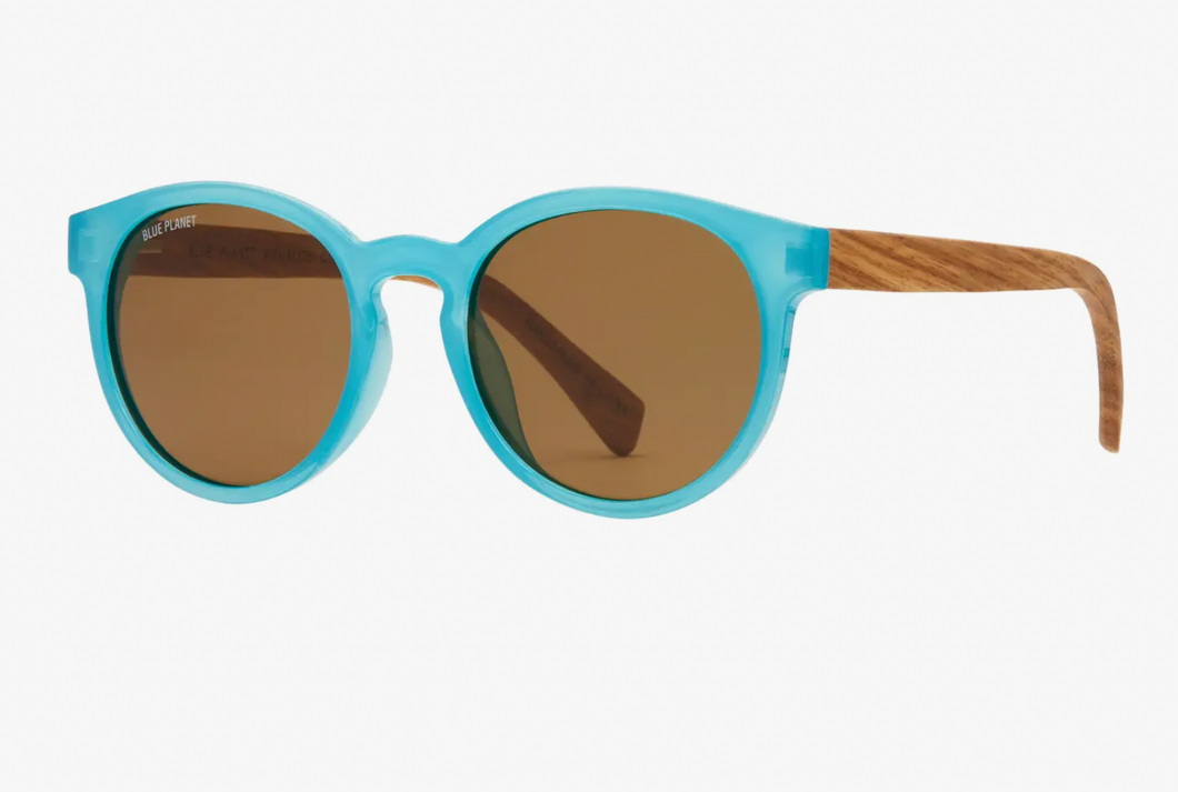 Round aqua blue sunglasses with wooden temples and brown tinted lenses, combining contemporary style with a touch of natural elegance.