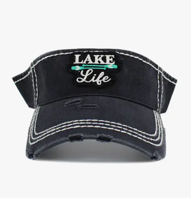 A black visor with stylish distressed detailing and a vibrant teal 