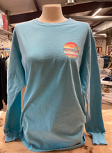 Load image into Gallery viewer, Caribbean blue long-sleeved ringspun cotton t-shirt on a mannequin, with the &#39;Cedar Creek Lake Life&#39; logo on the left chest, displayed in a retail setting.