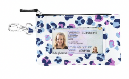 A playful card holder featuring a navy and pink leopard print with a transparent ID pocket on the front, merging convenience with a touch of whimsy.