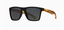 Load image into Gallery viewer, Black frame sunglasses with unique tribal-engraved bamboo arms and smoke polarized lenses for eco-friendly fashion and clear vision.