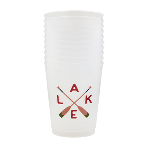 A stack of white plastic cups with a design of crossed oars and the letters "L A K E" in a warm color palette of red and brown, symbolizing a cozy, adventurous lake lifestyle.