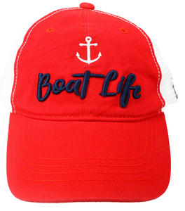 A red baseball cap with "Boat Life" in cursive, navy embroidery and a white anchor symbol above the phrase, set against a white mesh background, suggesting a marine-themed design.